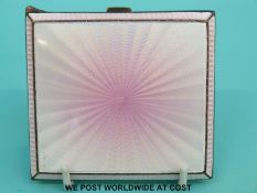An Art Deco hallmarked silver cigarette case with engine turned back and pink guilloche enamel