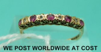 A 9ct gold ring set with alternating diamonds and rubies (size M)