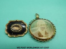 A Victorian yellow metal mourning brooch decorated with black enamel and seed pearls,