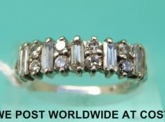 An 18ct white gold ring set with baguette cut and round cut diamonds in a platinum setting (size P)