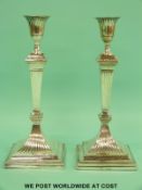 A pair of Victorian hallmarked silver candlesticks with a stepped base,