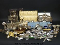 A quantity of silver plated items to include cased cutlery, egg set, jug,