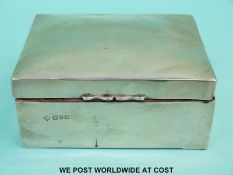 A hallmarked silver cigarette box,