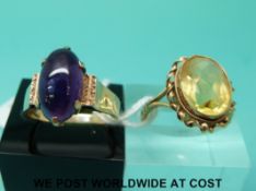 A 9ct gold ring set with an oval cut citrine (size P/Q) and a 9ct gold ring set with an amethyst