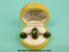 A 9ct gold ring set with a jadite cabochon and jadeite earrings