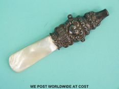 A hallmarked silver and mother-of-pearl baby's teether and whistle length 9.