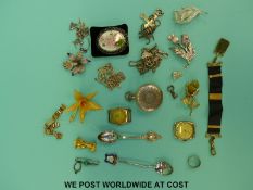 A collection of costume jewellery to include brooches, fob, Mizpah silver ring, a silver spoon,