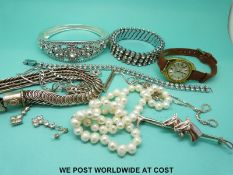 A white metal bracelet, two silver chains, brooch, bracelets,