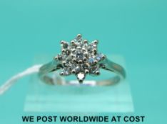 An 18ct white gold ring set with a cluster of diamonds (size Q)
