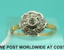 An 18ct gold ring set with old cut diamonds in a flower cluster (size N)