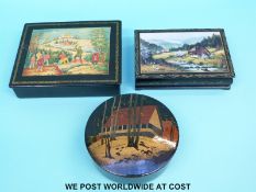 A collection of Russian lacquered boxes including hand-decorated examples,