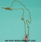 A 9ct gold pendant set with a ruby on 9ct gold chain