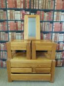A pine chest of drawers and a matching pair of bedside tables