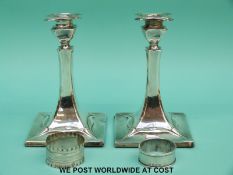 A pair of Arts & Crafts/Art Nouveau Walker and Hall Edward VII hallmarked silver candlesticks,