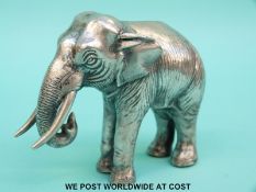 A possibly white metal model of an elephant,