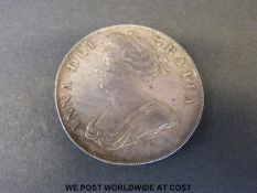 A Queen Anne crown with small rim nick, with plumes and roses,