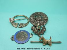 A Scottish hallmarked silver kilt pin, another hallmarked silver example, a thistle brooch,