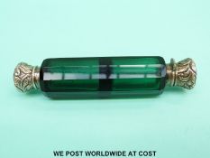 A green cut glass double ended scent bottle with embossed lids (one end is hinged,