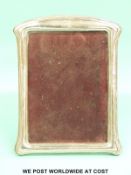 A pair of George V hallmarked silver photograph frames to suit approximately 7 x 5 inch photo,