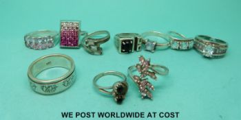 Ten silver rings set with various gems