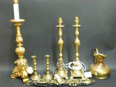 A collection of table lamps, horse brasses,