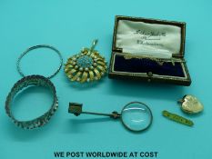 A silver napkin ring, silver christening bangle, 9ct gold cross and chain,