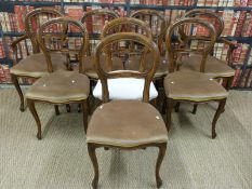 A set of eight upholstered balloon back chairs (2+6)