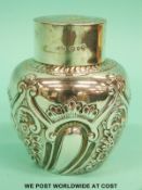 A Victorian hallmarked silver tea caddy with embossed decoration, London 1893,