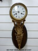 A 19thC wall sconce clock, supported by classical female spelter figure,