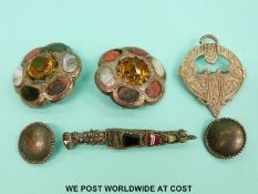 Two white metal specimen brooches set with agate and a large orange stone to the centre,