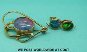 A yellow metal brooch set with an opal doublet and a pair of 9ct gold earrings set with synthetic
