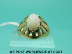 A 14ct gold ring set with an opal cabochon (size P)