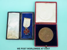 A cased bronze 1902 Coronation medal and a cased red enamel cross