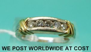 An 18ct bi-coloured gold ring set with five diamonds (size L)