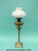 A Corinthian column oil lamp with cut glass reservoir