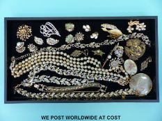 A quantity of costume jewellery to include Sarah Coventry brooch, earrings,