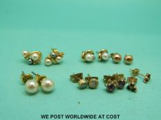 Seven pairs of 9ct gold and yellow metal earrings,