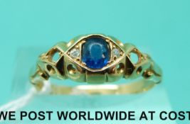 An 18ct gold ring set with a sapphire and diamonds (size O)