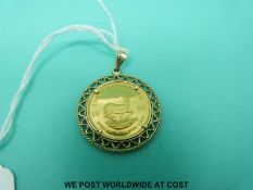 A 1/4 Krugerrand in 9ct gold pendant mount (10.