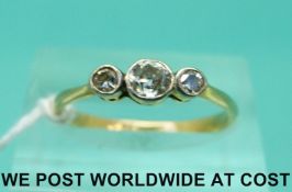 An 18ct gold ring set with three old cut diamonds (size M)