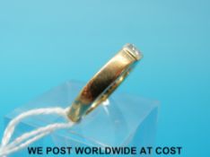 An 18ct gold ring set with a princess cut diamond (size L)