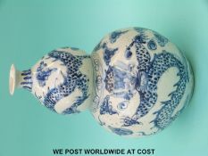 An Oriental blue and white double gourd vase (height 35cm)