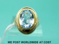 A 14ct gold ring set with a large oval aquamarine (size M)