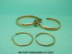 A pair of yellow metal earrings and a 9ct gold pair (15.