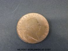 A 1793 Bermuda penny of George III better than VF with some luster