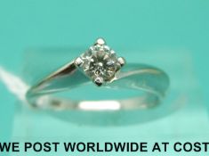 An 18ct white gold ring set with a diamond of approximately 0.