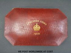 A cased 1902 specimen coin set, including gold £5 coin, double sovereign, half sovereign,