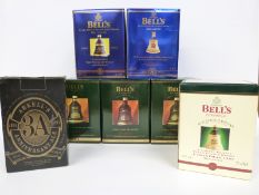 A collection of boxed Wade commemorative sealed Bell's Whisky decanters: Christmas 1992,