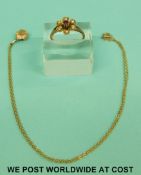 A 9ct gold ring set with a ruby surrounded by seed pearls and a 9ct gold necklace