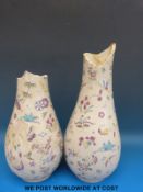 A pair of 19thC Chinese vases with enamelled insect and floral decoration
